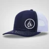 Navy blue and white mesh trucker cap with a white Volcom stone logo embroidered on the front. Adjustable and breathable.