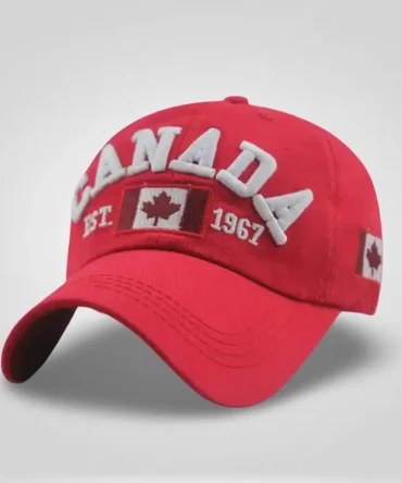 Adjustable white men's baseball cap with "CANADA" embroidery, Canadian flag detail, and "EST 1967" text.