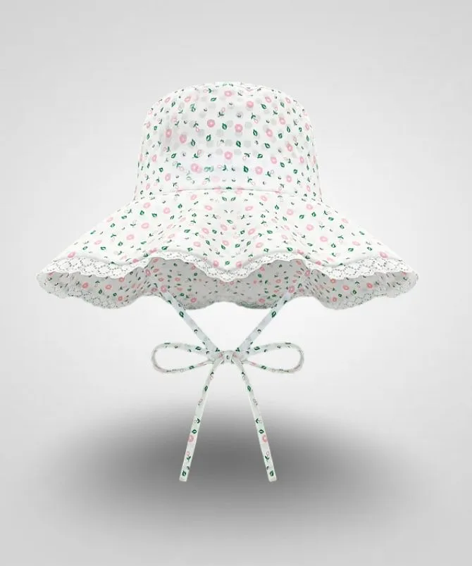 Toddler floral sun hat with blue and yellow flowers, wide brim, and white lace trim, tied with a matching bow under the chin. Ideal for summer and sun protection.