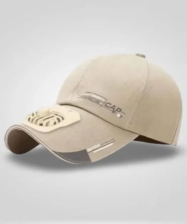 A light beige baseball cap with a small, white, battery-operated fan attached to the brim, featuring "FASHION LINE CAP" text and reflective accents.