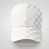 White and gold checkered baseball cap with a subtle mesh texture, side view.