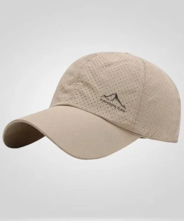 Perforated beige "Pahoda Cap" baseball cap with a mountain logo, ideal for sun protection and outdoor activities.