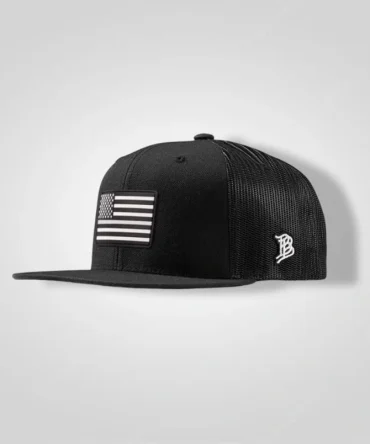 Baseball Cap black flat-bill trucker hat with grayscale American flag patch and white 'B' logo, Branded Bills Vintage Old Glory PVC Flat Trucker.