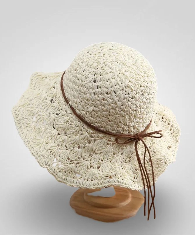 Crochet straw hat for women with a brown leather tie, lightweight and foldable design, ideal for sun protection and beachwear, D&T 2025 fashion collection.