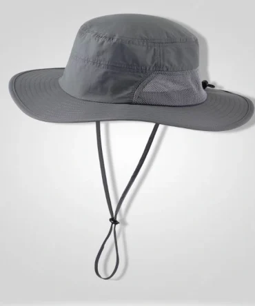 "Connectyle Men's UPF 50+ wide brim boonie hat in grey, front view, featuring a breathable mesh side panel and adjustable chin strap for outdoor activities like fishing and hiking."