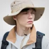 khaki fishing bucket hat, wide brim, adjustable chin strap, outdoor sun protection, hiking, camping, unisex, breathable